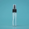 Transparent plastic spray bottle with a black pump head and clear cap on aqua background - 30ML Slim / Black Spray