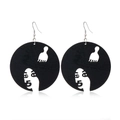 Detailed view of black wooden earrings with white carved face silhouette and comb design - Style 5 (Portrait Comb)