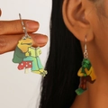Acrylic Frog and Toad earrings featuring frog reading book on a red mushroom - Acrylic Frog 1820