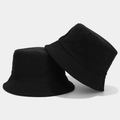 Close-up of black corduroy and cotton twill bucket hats showing fabric texture contrast - One Size / Black