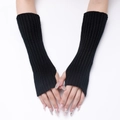 Detail of black ribbed knit arm warmers with thumb holes for winter warmth and flexibility - Black