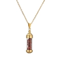Detail of gold capsule pendant necklace with red crushed stones and polished finish - Gold Red Stone