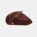 Detailed macro of dark brown wool beret featuring a vintage silver metal logo emblem - One Size / Coffee