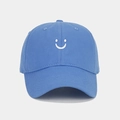 Detailed close-up of sky blue cotton baseball cap with white smile face embroidery - Adjustable / Sky Blue