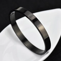 Minimalist black titanium steel bangle with polished finish and snap buckle closure - Circumference 18cm / 8MM Black