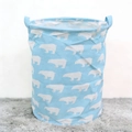 Light blue fabric laundry basket with white polar bear pattern and dual carry handles - Blue Polar Bear
