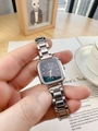 Close-up of a silver steel strap women's watch with a deep green square dial and logo - Dark Green