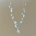 Detalle de collar multicapa con estrellas de mar, conchas, perlas y cuentas azules - Estilo de Varias Capas Perla Concha Estrella de Mar (Collar-Plata-Azul-Estrella de mar)