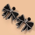 Detailed view of elegant black bow earrings with sparkling silver rhinestones trim - Black Sparkling Diamond Bow Earrings