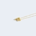 Elegant gold necklace with minimalist pearl-inlaid letter F pendant on white background - Letter F