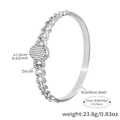 Bracciale a catena in acciaio argento con piastra ovale in zirconi, diametro 5,9 cm - Zirconia Bianca / Color Acciaio