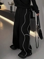 Women's black wide-leg trousers featuring wavy side stripes and elastic waist design - S / Black