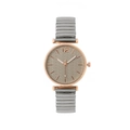 Macro shot of rose gold watch case and leaf stem pattern dial on stretch band watch - Silver