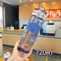 Close-up of 720ml square water bottle with purple silicone sleeve and hand strap - 720ml / Blue