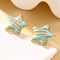 Detail of star-shaped earrings with blue marble enamel and gold plated edges - Light Blue Marble Texture (DYX-3)