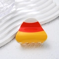 Halloween candy corn hair clip in white, orange, and yellow resin on wave display - Hat / 6cm