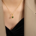 Gold plated Egyptian pharaoh necklace featuring an oval green gemstone with zircon inlay - Necklace / Gold Green Zirconia / 40+5cm