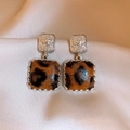 Close-up of leopard print square pendant earrings on soft beige fabric background - 49# Silver Earring Post - Silver - Coffee