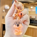 Cute orange liquid bear keychain with white letter cubes inside and matching bell - Mini Sitting Bear - Orange