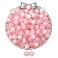 Close-up of pink cat eye resin beads in a silver tray for DIY jewelry making - Light Pink