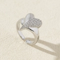 Detail of silver heart ring featuring asymmetrical zircon pavé and adjustable band - Style 10