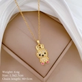 Close-up of golden bunny necklace with pavé crystals, red eyes and pink stone details - Gold Zirconia Rabbit Pendant (C546)