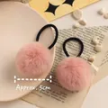 Close-up of pink faux fur pom-pom hair ties with 5cm diameter and elastic band - Korean Pink Pom Pom 5cm