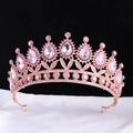 Detail of pink crystal bridal tiara with pear-shaped rhinestones on white silk fabric - KC Gold With Full Pink Stones