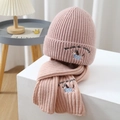 Close-up of pink knitted hat and scarf set featuring dog embroidery and motivational text - Pink