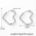 Minimalist silver heart-shaped stainless steel huggie hoop earrings with wavy texture - Textured Heart Silver Color Earrings