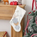 Detailed view of white plush Christmas stocking with blue and gold snowflake embroidery - Snowflake with Pompoms