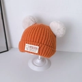 Orange baby knit beanie with large white faux fur pom poms and a small woven patch - 6 Months - 3 Years (33-52cm) / Orange (Dual Pom Poms)