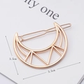 Detail view of a rose gold moon-shaped hollow hair clip with 5.5cm size markings - Hollow Moon Gold