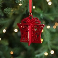 Red flocked Christmas gift box ornament with bow and gold glitter on tree branch - Red Flocked Gift Box