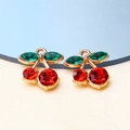 Miniature cherry charm with red faceted crystals and green leaf in golden alloy finish - Style 24