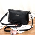 Chic black litchi pattern leather crossbody bag with triple zipper pockets and adjustable strap - Black