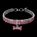 Close-up of pink rhinestone pet collar with sparkling bone-shaped crystal pendant - Pink / S