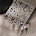 Detail of Co-316 3D embossed nail stickers with checkerboard and heart patterns - Black & Silver Checkerboard Heart Series (CO-316 Silver Hot Stamping)