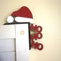 Close-up of Ho Ho Ho Christmas door corner decoration with Santa hat design on white frame - HO HO HO Santa Hat