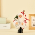 Santa Claus plush doll in red knitted hat holding silver gift bag on desk display - Gift Bag (Red & White Deer)