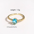 Minimalist gold ring featuring a 5x7mm sky blue zircon stone with adjustable open band - Light Blue Gemstone Gold Plated