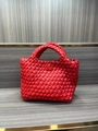 Mini red woven bucket bag with elegant handcrafted texture and matching top handle - Red
