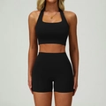 Two-piece black yoga set with halter sports bra and high-waisted shorts for fitness - S / Premium Black