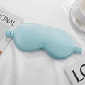 Light blue faux silk sleep mask with elastic strap on elegant white fabric surface - Fresh Green