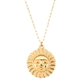 Macro detail of a vintage gold sun face pendant with textured engraving on a chain - Gold Vintage Sun Face