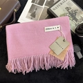Pink cashmere-feel knit scarf with fringe tassels shown folded with product tags - 200x68cm / Deep Pink