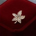 Elegant gold maple leaf brooch with sparkling crystals on a red velvet jewelry box - Gold Maple Leaf Style (90161J)