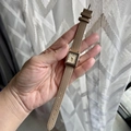 Chic square rose gold watch with beige leather strap held naturally by a female hand - Light Coffee
