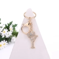 Golden keychain with rhinestone letter Y and crown charm featuring a secure lobster clasp - Letter Y / Gold