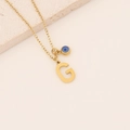 Golden stainless steel letter G necklace featuring a blue evil eye bead pendant - Letter G